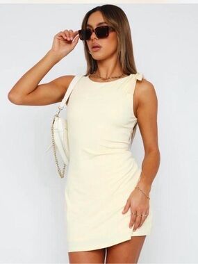 White fox pale yellow mini dress with bow detail on the shoulder size S